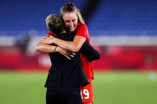 Jordyn Huitema of Canada celebrate the victory with head coach Bev Priestman after the penalty shot out of the Olympic women's football gold medal...