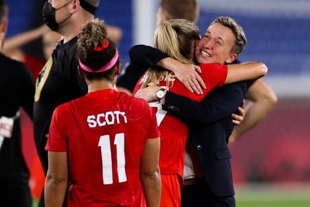 Bev Priestman head coach of Canada celebrate the victory with player after the penalty shot out of the Olympic women's football gold medal match...