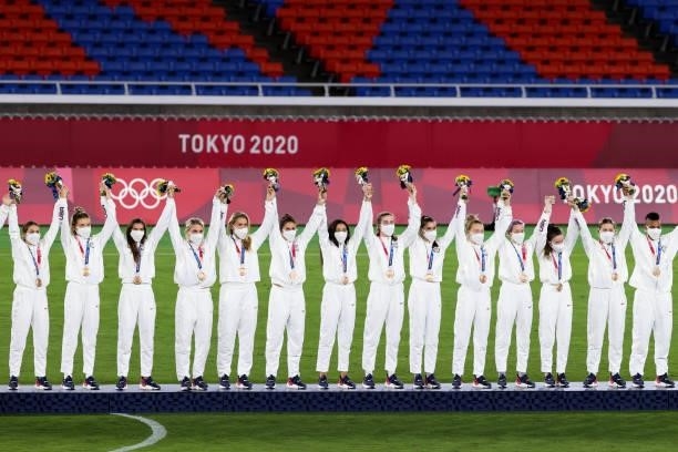 Players of United States attend the award ceremony of the Olympic women's football gold medal match between Sweden and Canada at International...