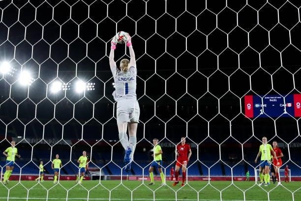 Hedvig Lindahl of Sweden competes for the ball during the Olympic women's football gold medal match between Sweden and Canada at International...