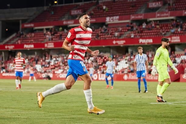 Antonio Puertas of Granada CF celebrates after scoring his team's third goal during the Ciudad de Granada trophy match between Granada CF and Malaga...