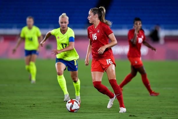 Caroline Seger of Sweden and Janine Beckie of Canada during the Tokyo 2020 Olympic Women's Football Tournament Gold Medal match between Sweden and...