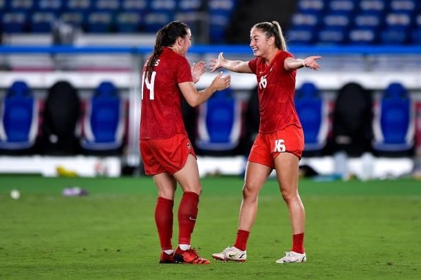 Vanessa Gilles of Canada and Janine Beckie of Canada celebrate victory during the Tokyo 2020 Olympic Women's Football Tournament Gold Medal match...