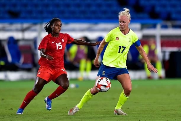 Nichelle Prince of Canada and Caroline Seger of Sweden during the Tokyo 2020 Olympic Women's Football Tournament Gold Medal match between Sweden and...