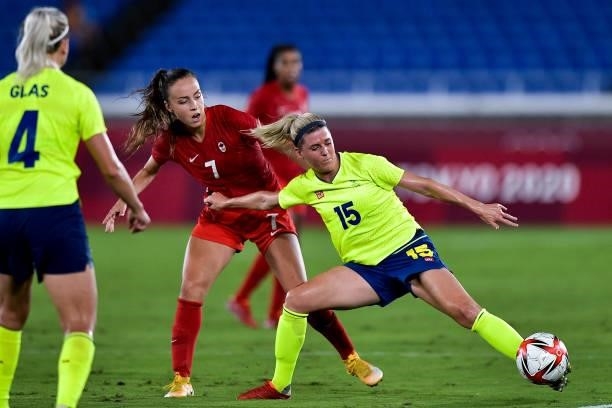 Julia Grosso of Canada and Olivia Schough of Sweden during the Tokyo 2020 Olympic Women's Football Tournament Gold Medal match between Sweden and...