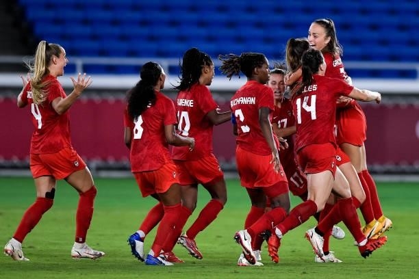 Vanessa Gilles of Canada, Ashley Lawrence of Canada and Kadeisha Buchanan of Canada celebrate with Julia Grosso of Canada during the Tokyo 2020...
