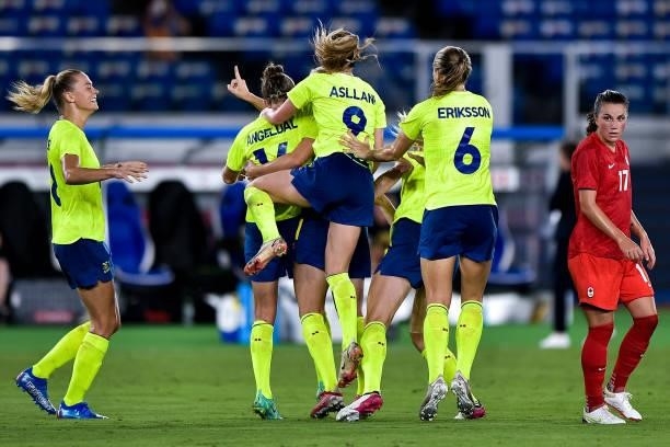 Stina Blackstenius of Sweden celebrates with Kosovare Asllani of Sweden and Magdalena Eriksson of Sweden after scoring her sides first goal during...