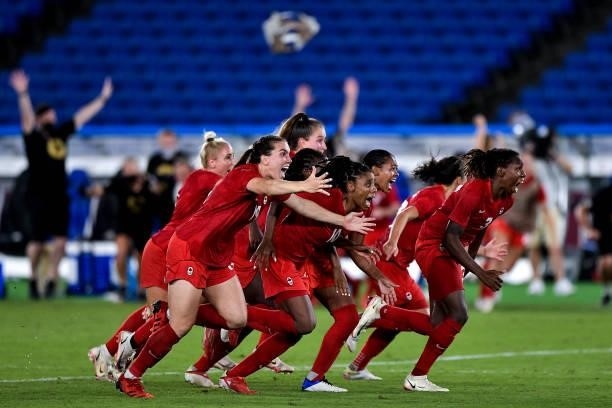 Vanessa Gilles of Canada, Ashley Lawrence of Canada and Kadeisha Buchanan of Canada celebrate during the Tokyo 2020 Olympic Women's Football...