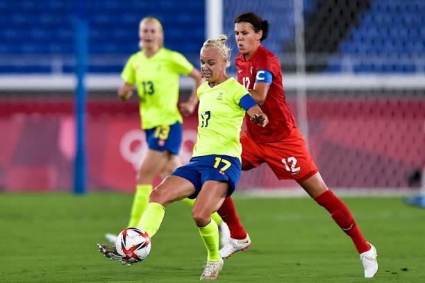 Caroline Seger of Sweden and Christine Sinclair of Canada during the Tokyo 2020 Olympic Women's Football Tournament Gold Medal match between Sweden...