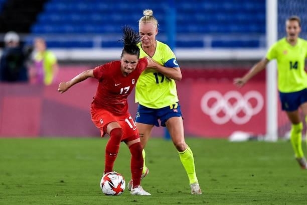 Jessie Fleming of Canada and Caroline Seger of Sweden during the Tokyo 2020 Olympic Women's Football Tournament Gold Medal match between Sweden and...