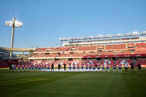 Players of Granada CF presented in the pitch prior to the Ciudad de Granada trophy match between Granada CF and Malaga CF at Nuevo Los Carmenes...