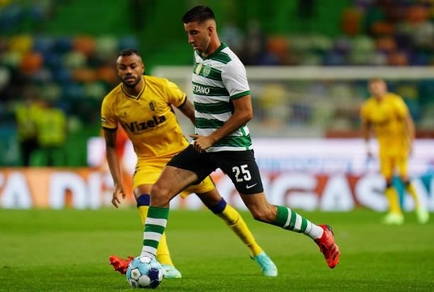 Goncalo Inacio of Sporting CP makes a pass under pressure of Cassiano of FC Vizela in action during the Liga Bwin match between Sporting CP and FC...