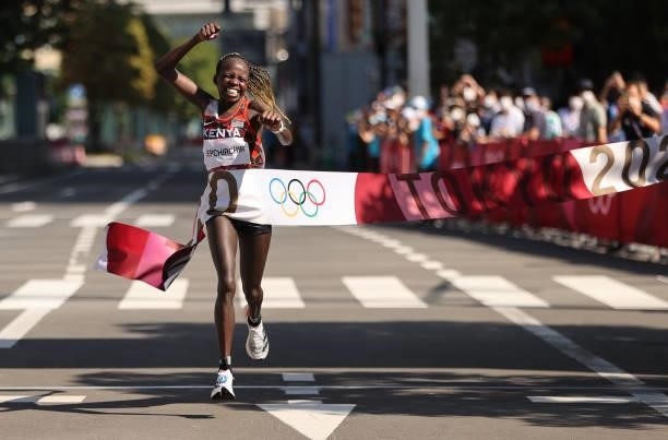 Peres Jepchirchir of Team Kenya celebrates as she crosses the finish line to win the gold medal in the Women's Marathon Final on day fifteen of the...