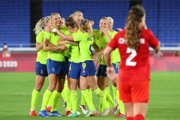 Team Sweden celebrates a goal by Stina Blackstenius of Team Sweden alongside Allysha Chapman of Team Canada to take a 1-0 lead in the first half...