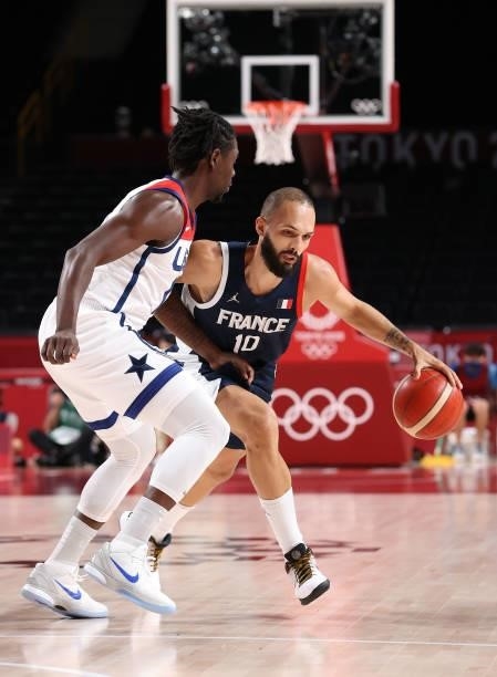 Evan Fournier of Team France drives to the basket against Team United States during the first half of a Men's Basketball Finals game on day fifteen...