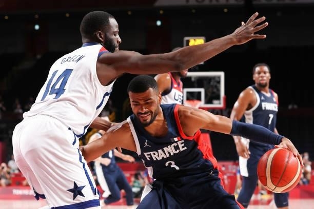 Timothe Luwawu Kongbo of Team France is defended by Draymond Green of Team United States during the first half of a Men's Basketball Finals game on...