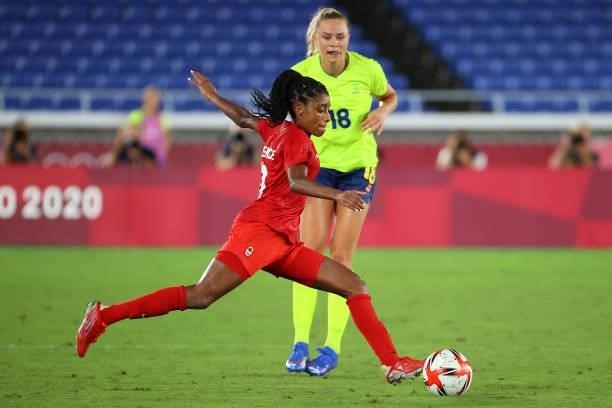 Ashley Lawrence of Team Canada looks to pass the ball against Fridolina Rolfo of Team Sweden in the first period of extra time during the women's...