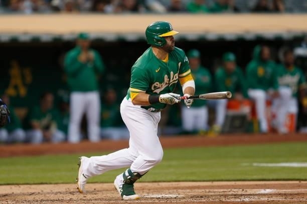 Mitch Moreland of the Oakland Athletics grounds into a double play, scoring Matt Olson in the bottom of the fourth inning against the Texas Rangers...