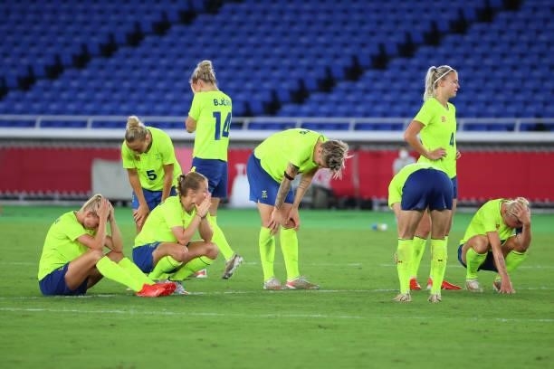 Team Sweden reacts after losing to Team Canada in a penalty kick shoot-out during the women's football gold medal match between Canada and Sweden on...