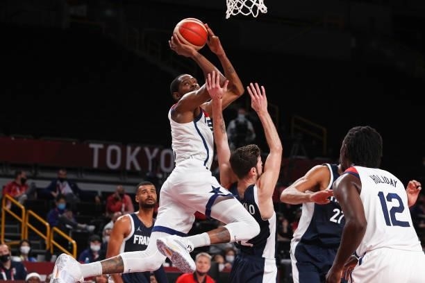 Kevin Durant of Team United States shoots against Nando de Colo of Team France during the first half of a Men's Basketball Finals game on day fifteen...