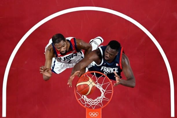 Moustapha Fall of Team France and Kevin Durant of Team United States jump for a rebound during the first half of a Men's Basketball Finals game on...