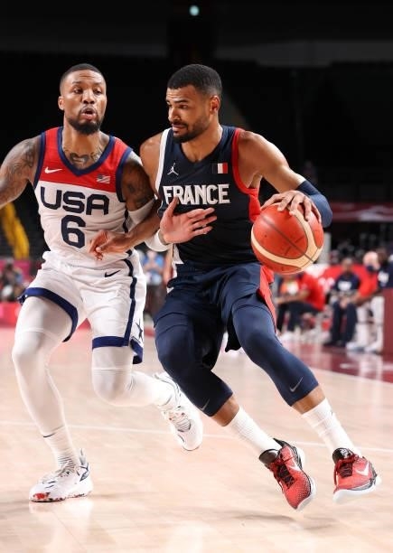 Timothe Luwawu Kongbo of Team France drives to the basket against Damian Lillard of Team United States during the first half of a Men's Basketball...