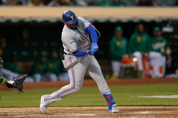 Curtis Terry of the Texas Rangers hits a double in the top of the fifth inning against the Oakland Athletics at RingCentral Coliseum on August 06,...