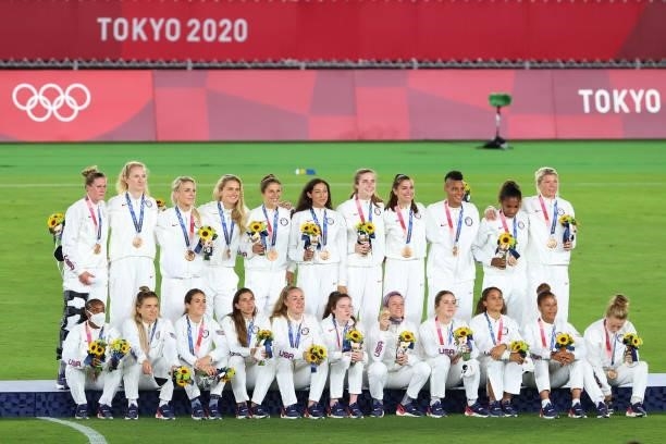 Team Untied States pose during the medal ceremony after receiving their bronze medals on day fourteen of the Tokyo 2020 Olympic Games at...