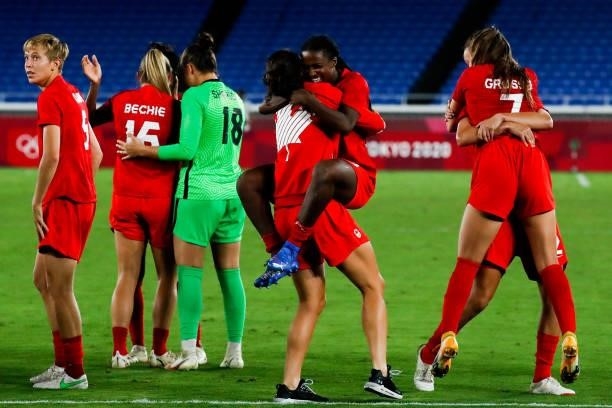 Players of Canada celebrate the victory after the penalty shot out of the Olympic women's football gold medal match between Sweden and Canada at...