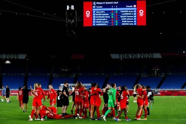 Players of Team Canada celebrate the victory after the penalty shot out of the Olympic women's football gold medal match between Sweden and Canada at...