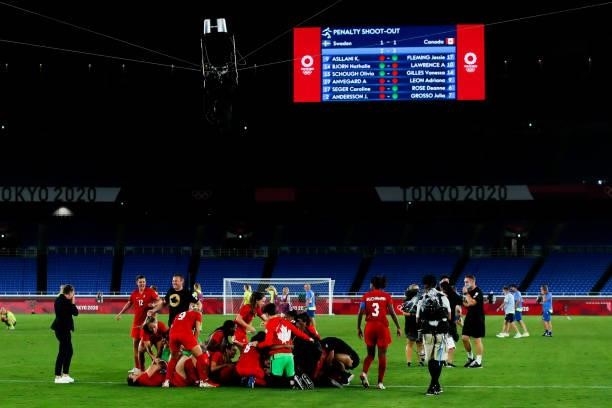 Players of Team Canada celebrate the victory after the penalty shot out of the Olympic women's football gold medal match between Sweden and Canada at...