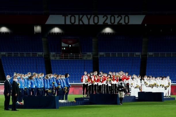 Players of Team Canada attend the award ceremony of the Olympic women's football gold medal match between Sweden and Canada at International Stadium...