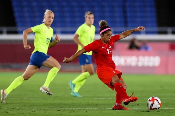 Desiree Scott of Team Canada pass the ball during the Olympic women's football gold medal match between Sweden and Canada at International Stadium...