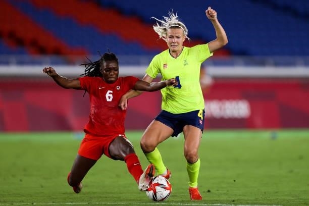 Deanne Rose of Team Canada competes for the ball with Hanna Glas of Team Sweden during the Olympic women's football gold medal match between Sweden...