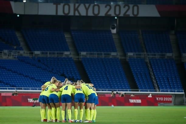 Players of Team Sweden encourage each other during the Olympic women's football gold medal match between Sweden and Canada at International Stadium...
