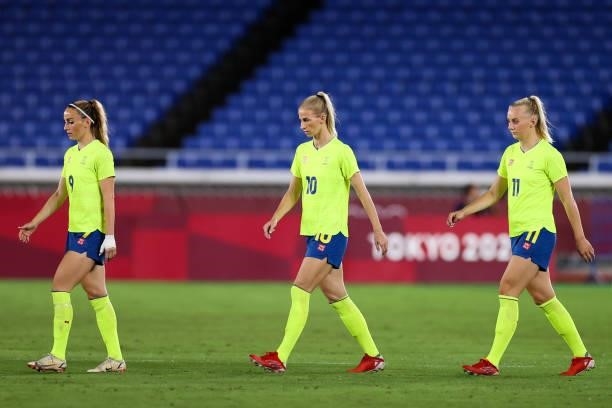 Kosovare Asllani, SoFia Jakobsson, Stina Blackstenius of Team Sweden wlaks onto the field during the Olympic women's football gold medal match...