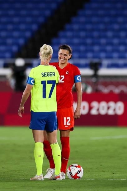 Christine Sinclair of Team Canada shakes hand with Caroline Seger of Team Sweden during the Olympic women's football gold medal match between Sweden...