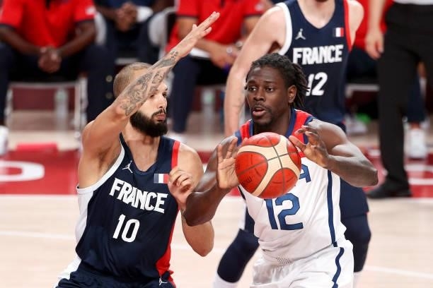 Jrue Holiday of Team United States passes the ball as Evan Fournier of Team France defends during the first half of a Men's Basketball Finals game on...