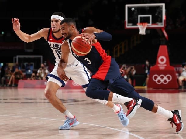 Timothe Luwawu Kongbo of Team France drives to the basket against Devin Booker of Team United States during the second half of a Men's Basketball...