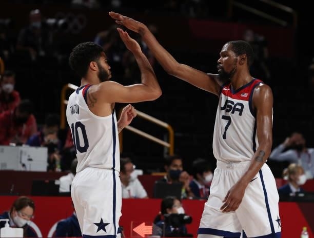 Kevin Durant of Team United States high-fives teammate Jayson Tatum during the second half of a Men's Basketball Finals game on day fifteen of the...
