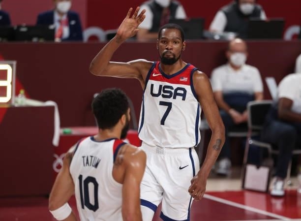 Kevin Durant of Team United States high-fives teammate Jayson Tatum during the second half of a Men's Basketball Finals game between Team United...