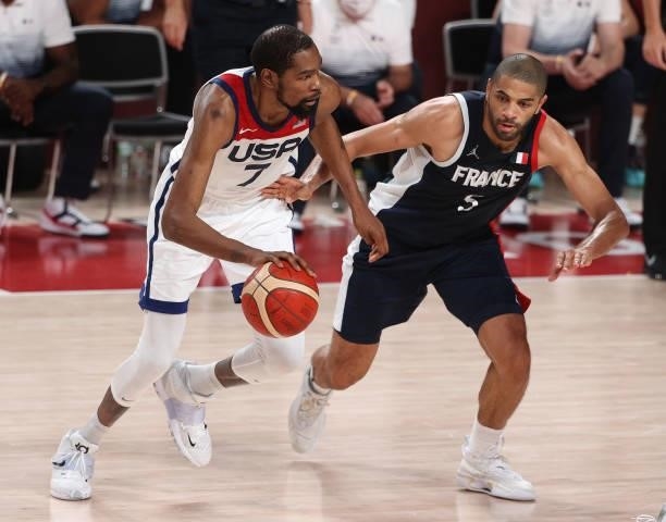 Kevin Durant of Team United States drives to the basket against Nicolas Batum of Team France during the second half of a Men's Basketball Finals game...