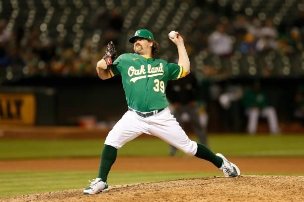 Andrew Chafin of the Oakland Athletics pitches in the top of the tenth inning against the Texas Rangers at RingCentral Coliseum on August 06, 2021 in...