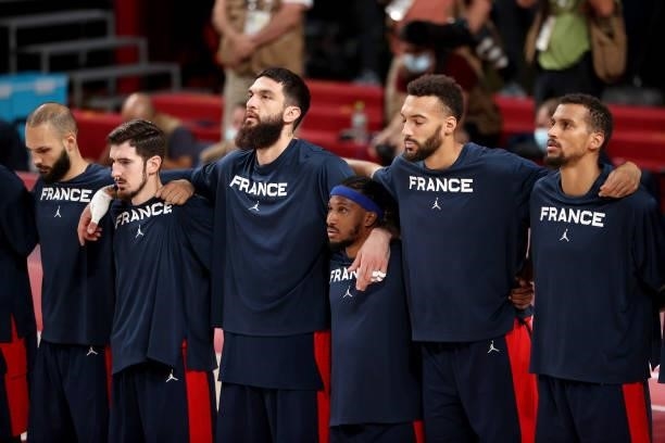 Members of Team France lock arms before the start of a Men's Basketball Finals game against Team United States on day fifteen of the Tokyo 2020...