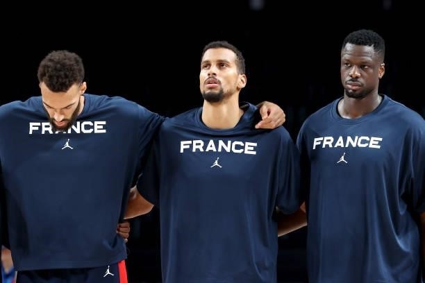 Members of Team France lock arms before the start of a Men's Basketball Finals game against Team United States on day fifteen of the Tokyo 2020...