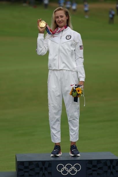 Nelly Korda of Team United States celebrates with the gold medal at the victory ceremony after the final round of the Women's Individual Stroke Play...