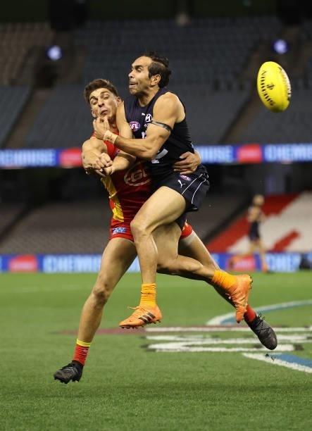 Eddie Betts of the Blues is challenged by Sean Lemmens of the Suns during the round 21 AFL match between Carlton Blues and Gold Coast Suns at Marvel...