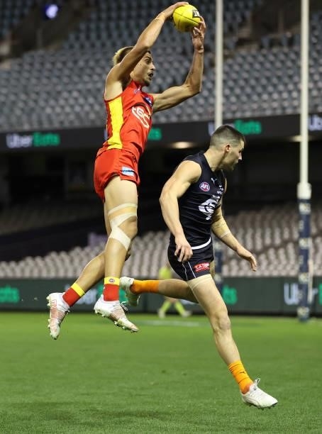 Joel Jeffrey of the Suns takes the ball during the round 21 AFL match between Carlton Blues and Gold Coast Suns at Marvel Stadium on August 07, 2021...