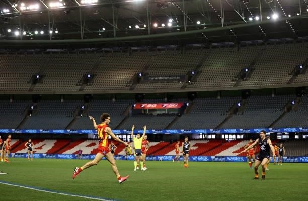 Ben King of the Suns kicks the ball during the round 21 AFL match between Carlton Blues and Gold Coast Suns at Marvel Stadium on August 07, 2021 in...