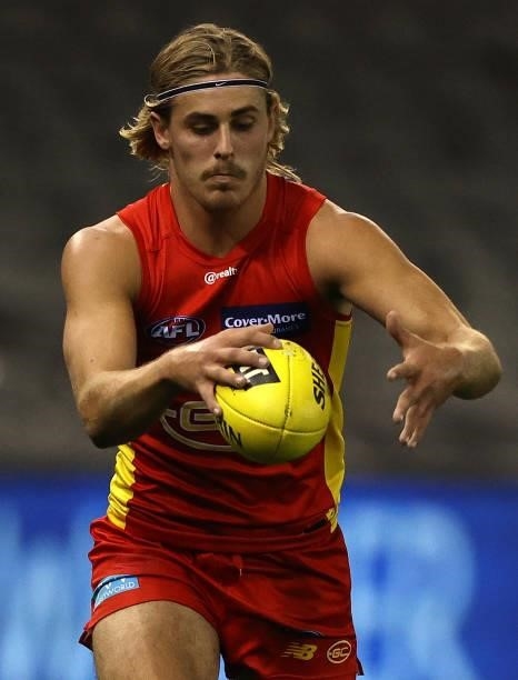Jeremy Sharp of the Suns controls the ball during the round 21 AFL match between Carlton Blues and Gold Coast Suns at Marvel Stadium on August 07,...